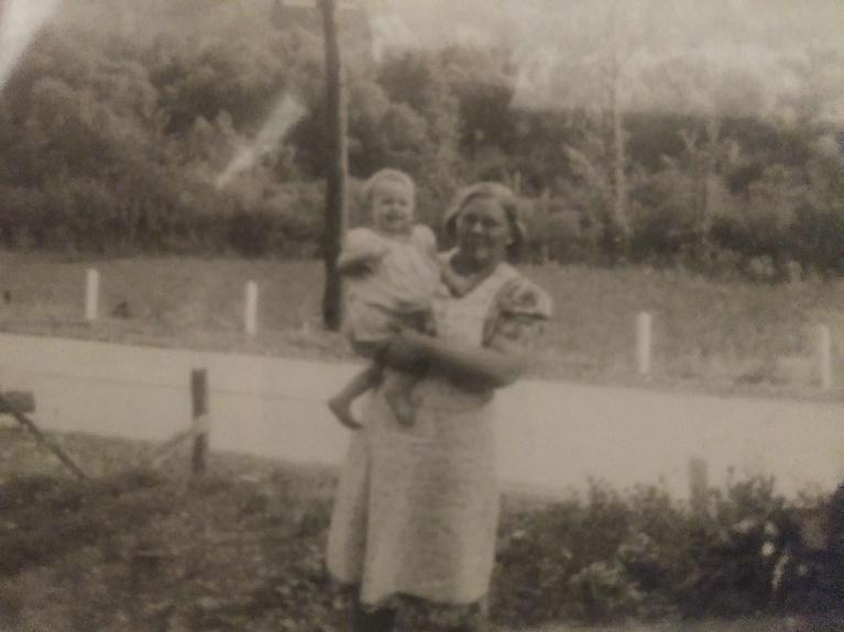A person holding a child

Description automatically generated with low confidence