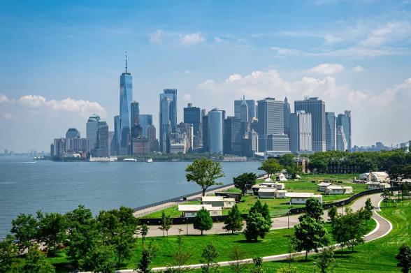 A view of Manhattan from the green landscape of Governors Island
