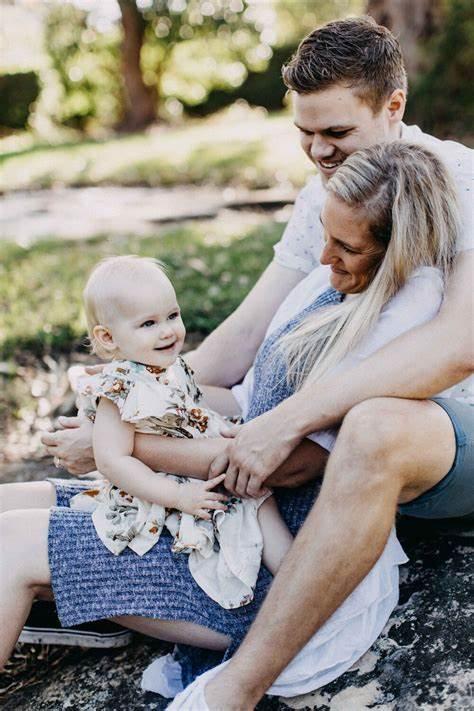 A person holding a person and a baby

Description automatically generated with low confidence