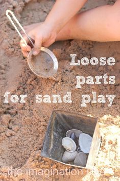 This may contain: someone is digging in the sand with a shovel and some rocks to play in it