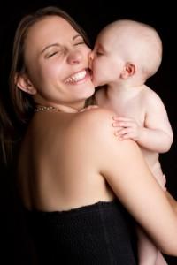 A person holding a baby

Description automatically generated