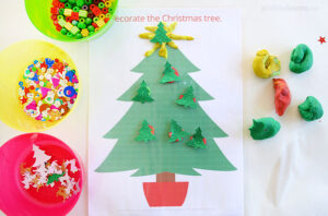 christmas tree playdough mat with bowls of sequins, beads and paper shapes