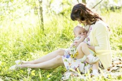 A person holding a baby

Description automatically generated with medium confidence