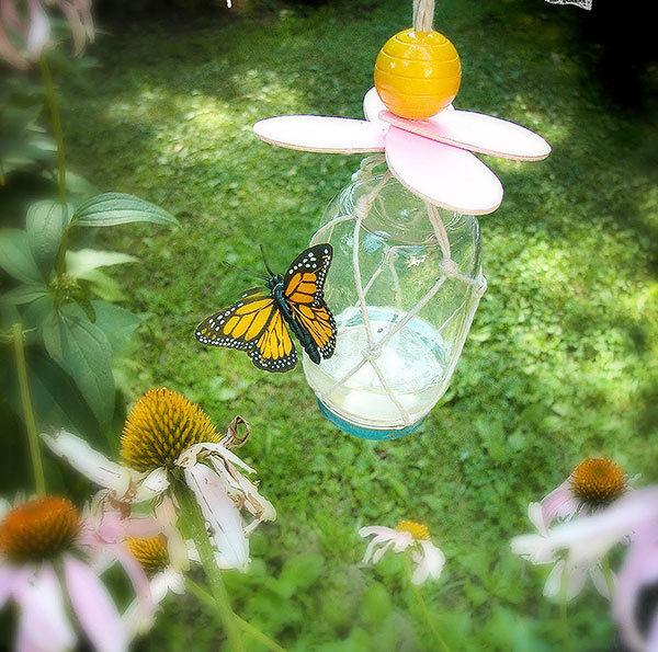 A butterfly on a flower

Description automatically generated