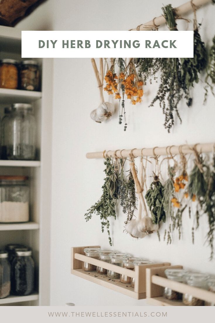 This may contain: herbs hanging on the wall with text overlay that reads how to make your own homemade herb tea blends