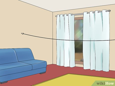 Step 2 Extend a clothesline across the room for an extra-large fort.