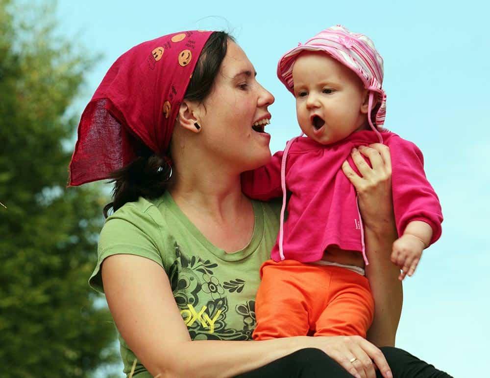 A person holding a baby

Description automatically generated with medium confidence