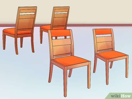 Step 1 Set up 2 rows of chairs with the backs facing each other.