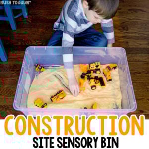 CORNMEAL CONSTRUCTION SITE - Check out this awesome sensory bin; an easy indoor activity; easy construction activity; sensory bin; toddler activity; preschool activity; construction themed sensory bin from Busy Toddler