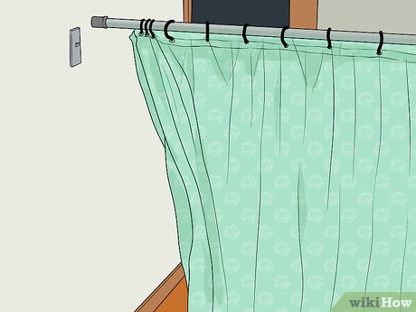 Step 1 Use an extendable curtain rod to support the ceiling in a small space.
