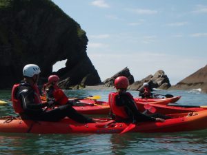 sea kayaking along the coast