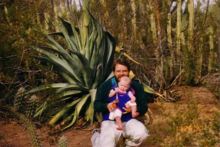 A person holding a baby

Description automatically generated with medium confidence