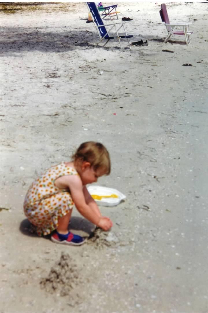 A child playing with a frisbee on the beach

Description automatically generated with medium confidence