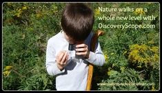 This may contain: a young boy looking through binoculars in a field with wildflowers behind him and a quote about nature walks on a whole new level with discovery
