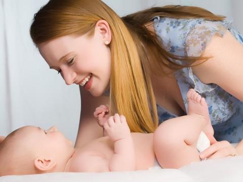 A person holding a baby

Description automatically generated with medium confidence
