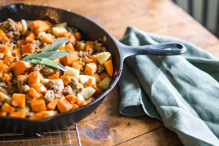 Sage sausage sweet potato apple hash in a skillet. www.inspirethemom.com