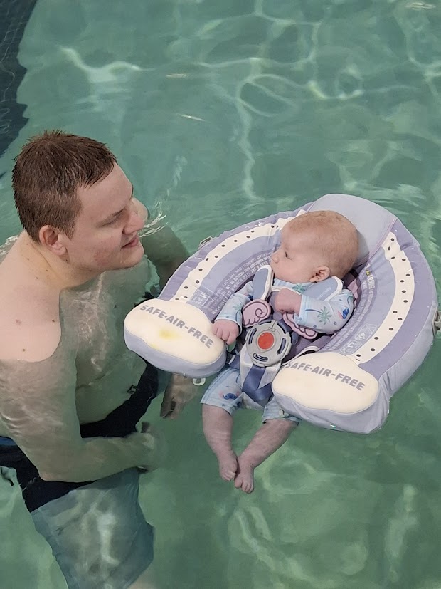 A person holding a child
Description automatically generated with low confidence